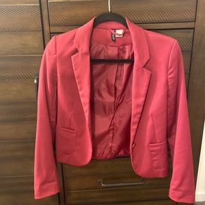 Red/maroon blazer.